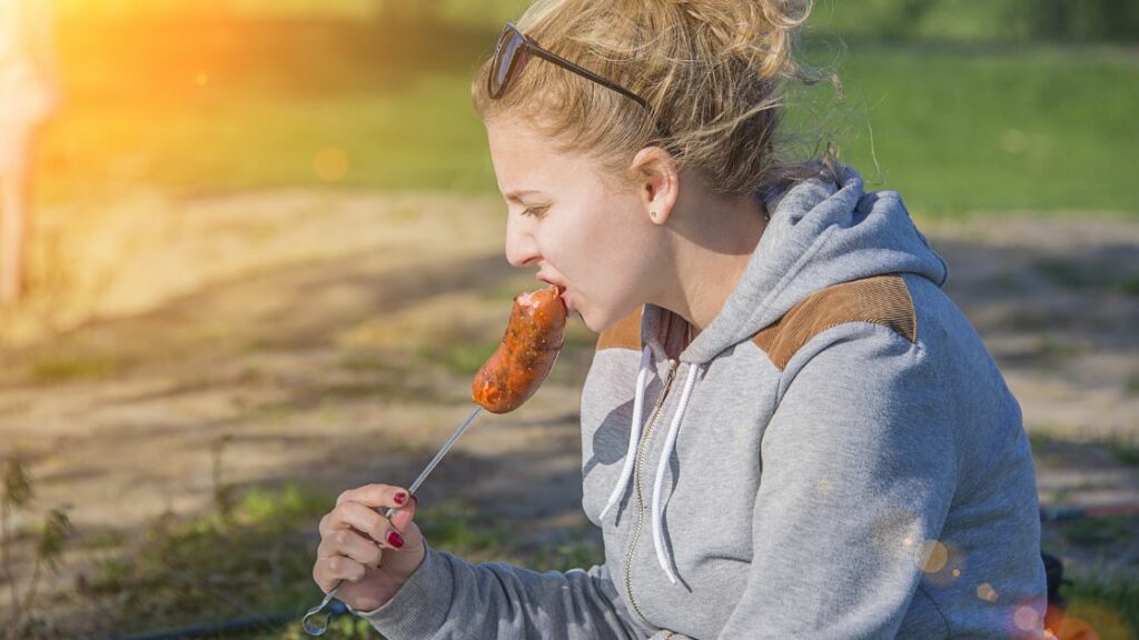 Sausage - girl eating