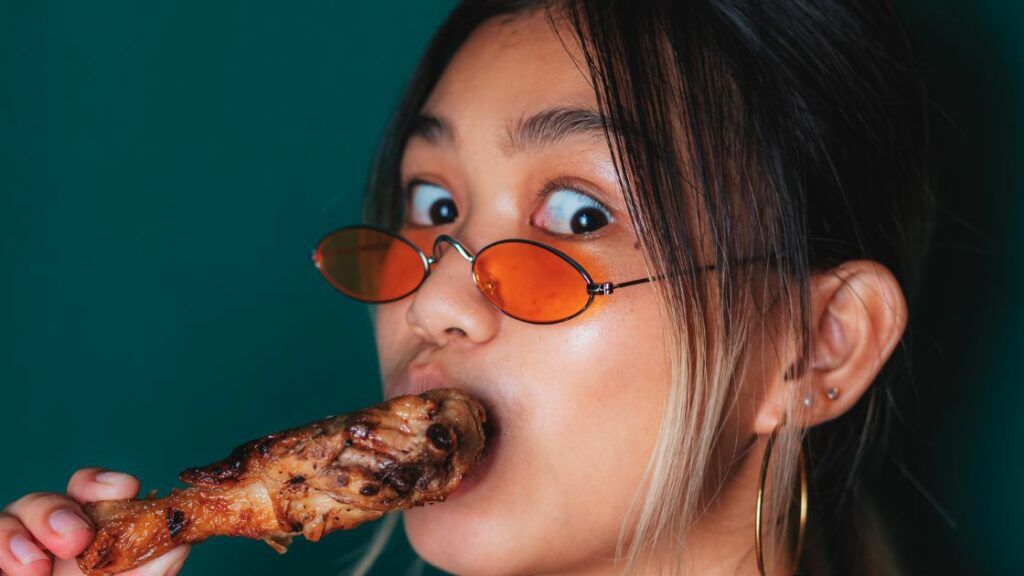 barbecue - girl eating chicken